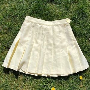 Soft yellow pleated miniskirt